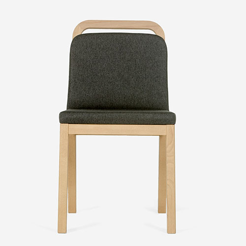 front of chair in dark green