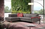 martine corner sofa γωνιακός καναπές σε γκρι σκούρο με κόκκινες λεπτομέρειες σε εκθεσιακό χώρο